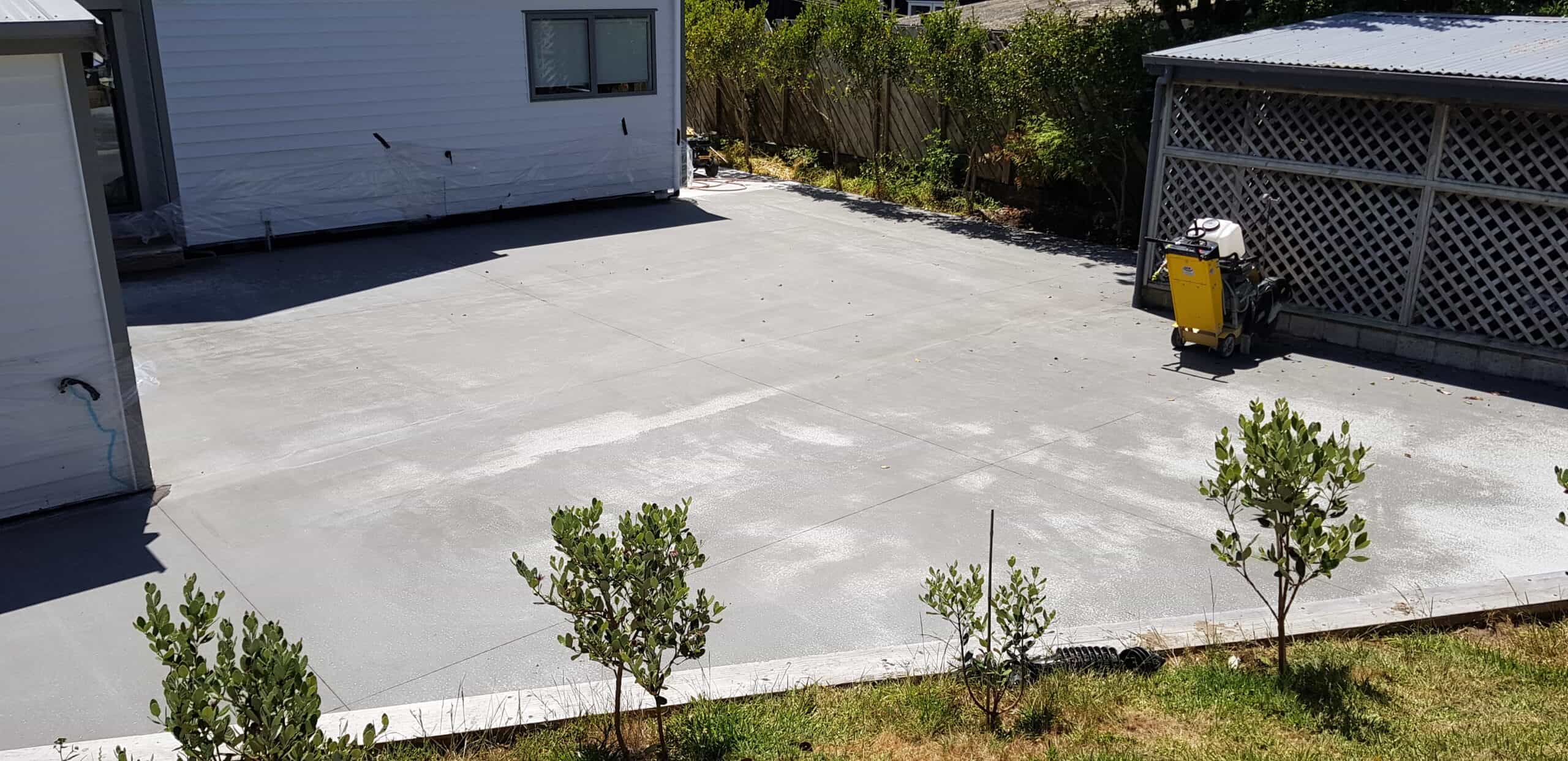 Before and after concrete driveway renovation in Paraparaumu